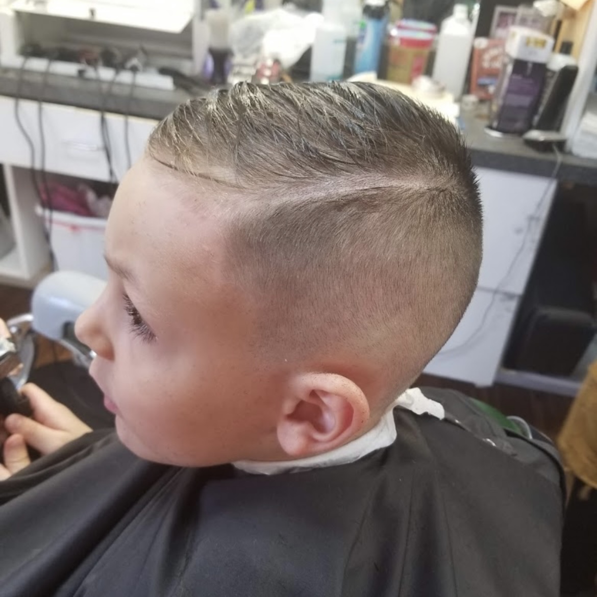 Classic tapered side part on a young client